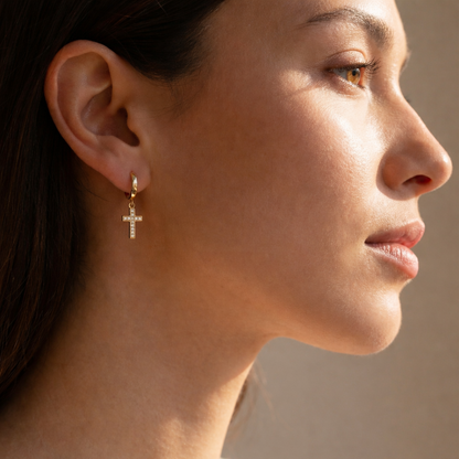 Women wearing cross hoop dangle earrings gold Christian faith jewelry